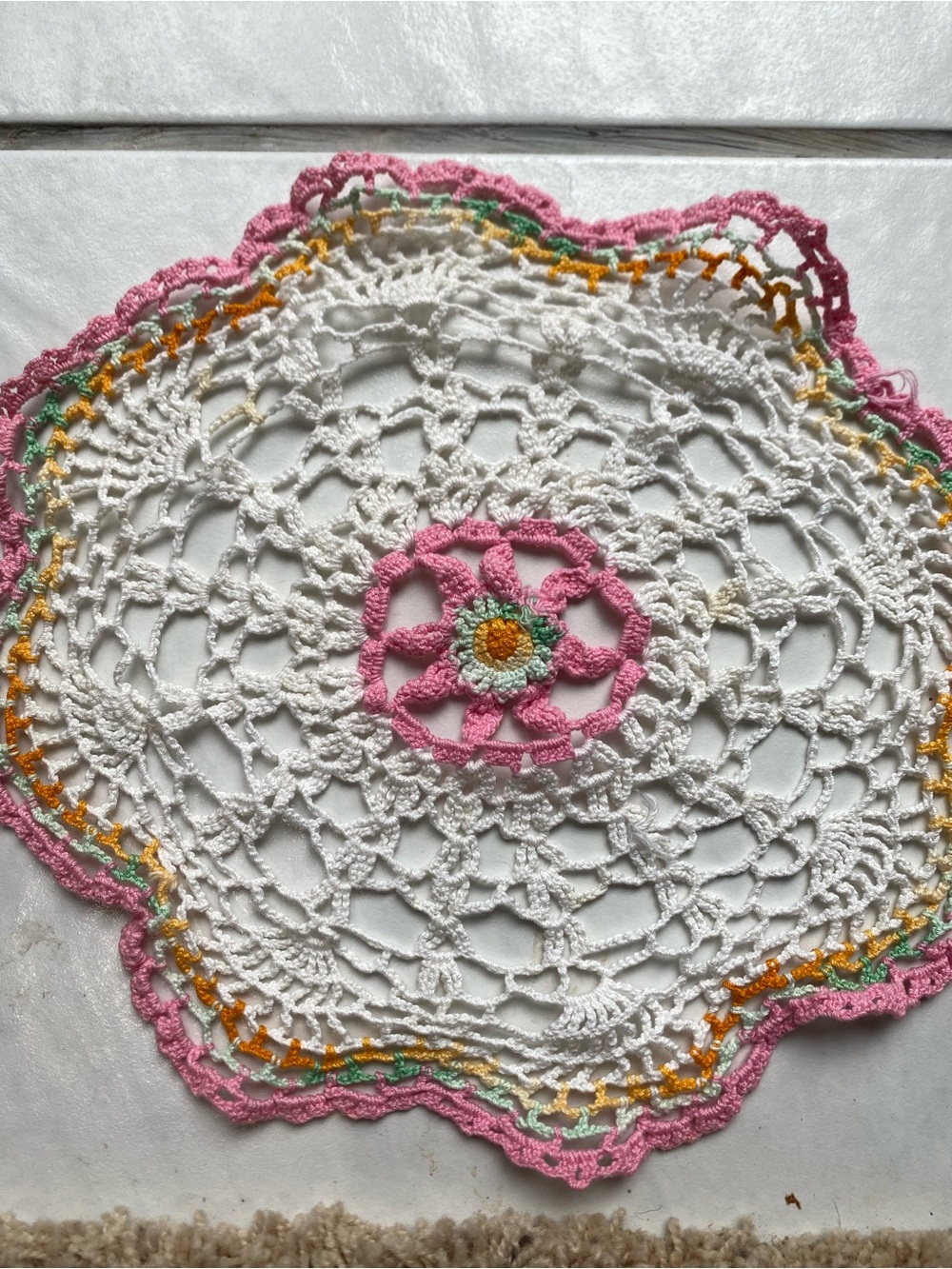 Handmade White Crochet Doily with Pink and Yellow Accent